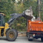 DPW photo collecting trash courtesy of the Town's Facebook page.