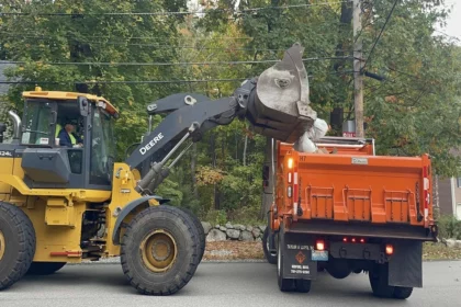 DPW photo collecting trash courtesy of the Town's Facebook page.