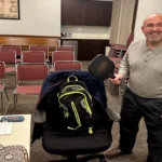 Board member Carlo Bacci displaying his pickle-ball racquet that he showcased during the Rec discussion on pickle-ball.