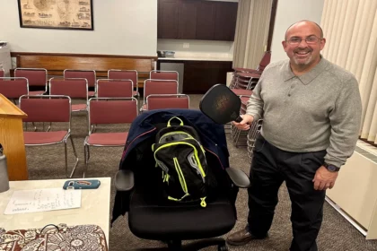 Board member Carlo Bacci displaying his pickle-ball racquet that he showcased during the Rec discussion on pickle-ball.