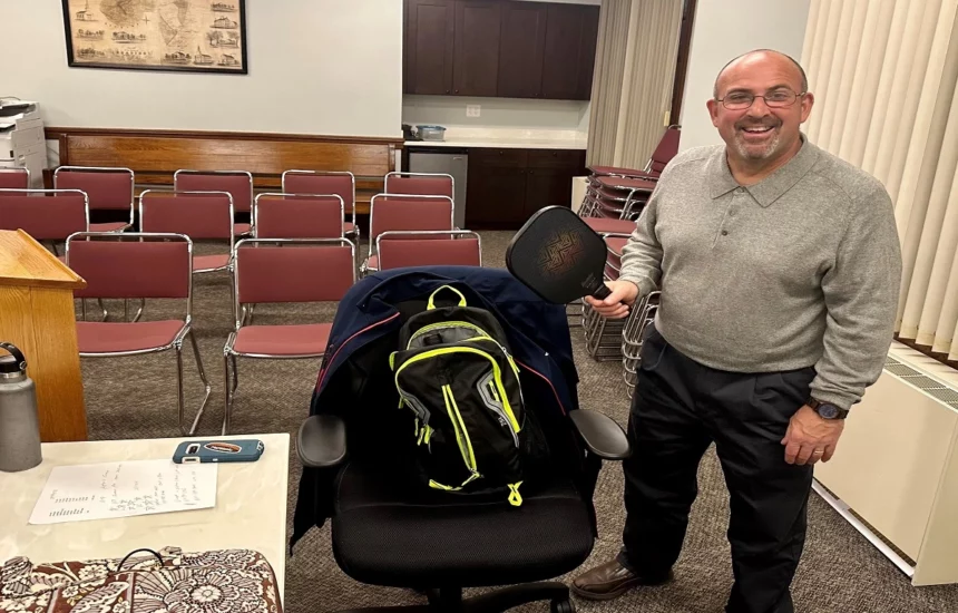 Board member Carlo Bacci displaying his pickle-ball racquet that he showcased during the Rec discussion on pickle-ball.