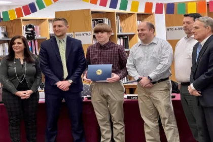 Brendan Manning with the members of the school committee in attendance and Superintendent Dr. Milaschewski