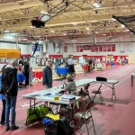 Voting takes place at the Hawkes Field House at Reading Memorial High School.