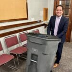 Town Manager Fidel Maltez demoing the 64 gallon trash barrel option at the Select Board earlier this year.