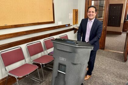 Town Manager Fidel Maltez demoing the 64 gallon trash barrel option at the Select Board earlier this year.