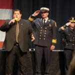 Todd Angilly of the Boston Bruins, sings the National Anthem