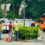 DPW workers installing the foundation for the parking kiosks at the Brande Court lot in June 2023.