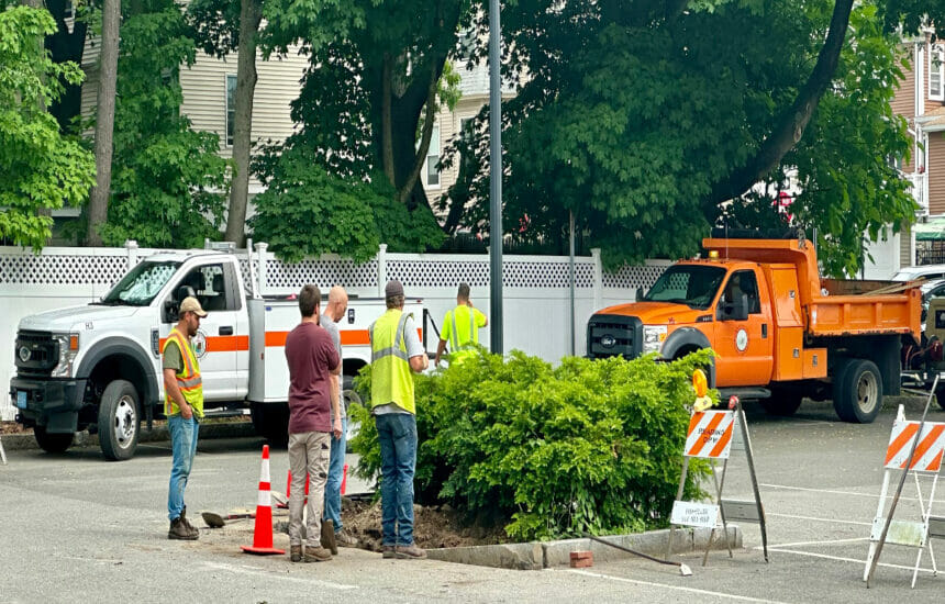 DPW workers installing the foundation for the parking kiosks at the Brande Court lot in June 2023.